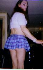 cumslut Crystal poses in school girl costume